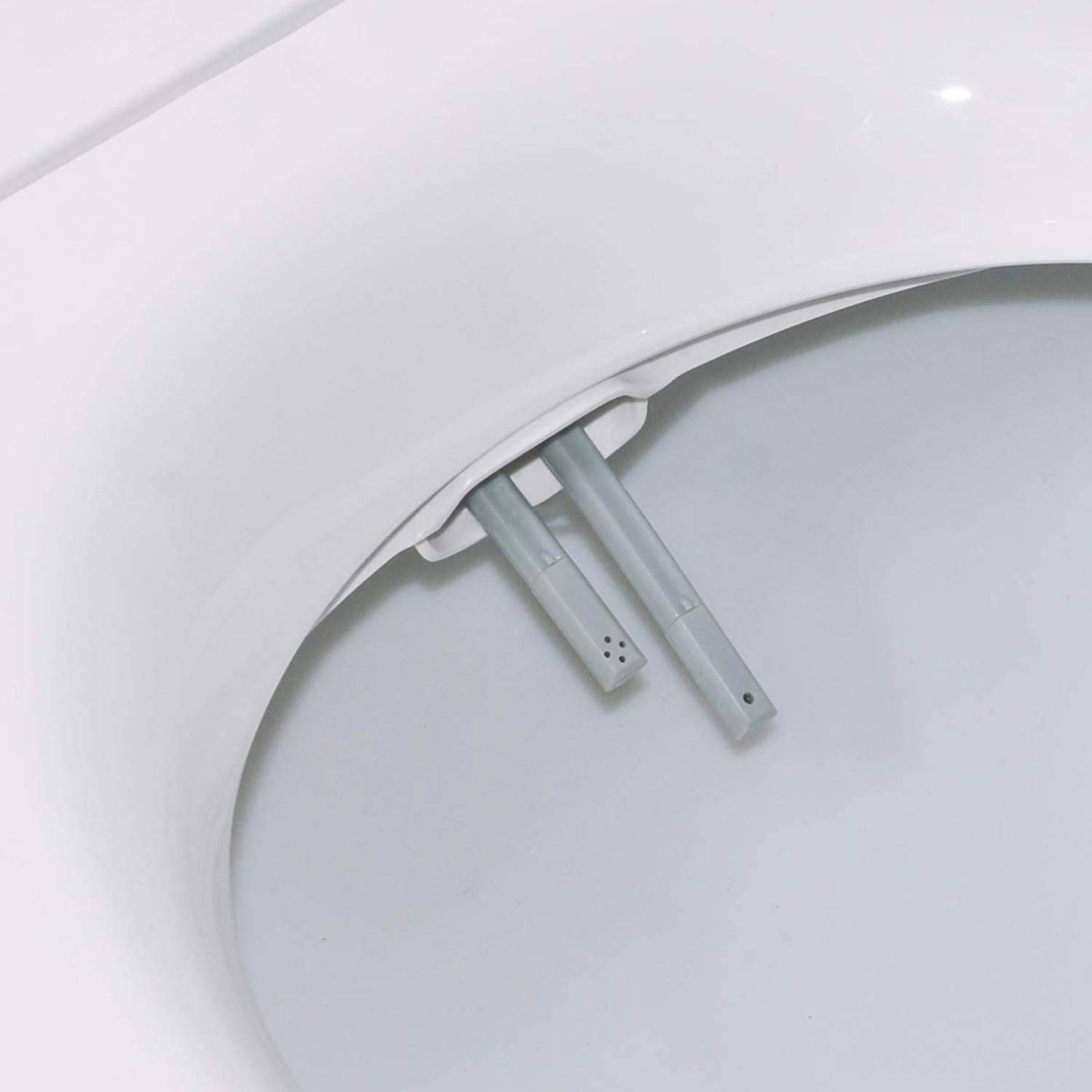 A non-electric bidet seat fitted in place of a standard toilet seat